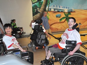 Lightening Thanh and Thunder Ben take a break from bowling to plan their next moves.