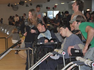 The team watches in hopes that Ben A. doesn't get a gutter ball.